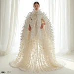 Avant-Garde White Couture Cape With 3D Cascading Platinum Spikes And Pearl Drops | trending photo editing prompt
